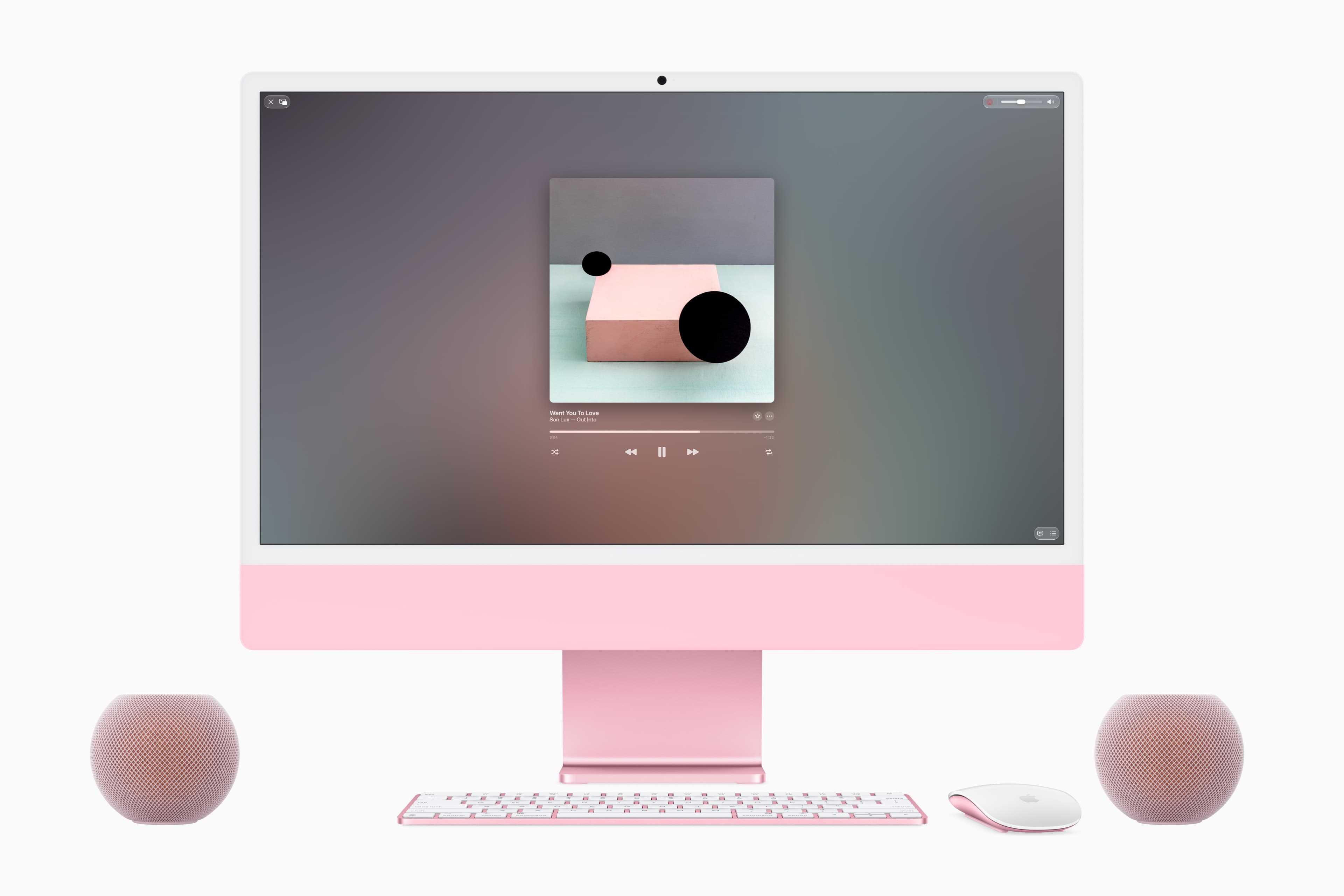 A pink HomePod mini 2 stereo pair working as speakers for a matching iMac. The new finishes are chosen to sit beside the iMac colours. Image: Apple Newsroom.